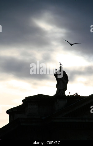 statues on top of colonnade at st peter's square in rome Stock Photo
