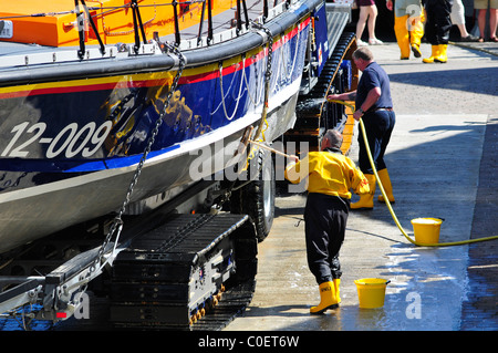 St. Ives Lifeboat in Cornwall, being washed down to remove sea salt outside of the main lifeboat house, on the slipway. Robert Timoney/Alamy/Stock/ Stock Photo