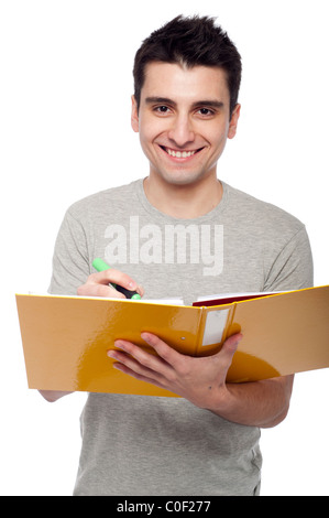 smiling young man studying with a dossier (isolated on white background) Stock Photo