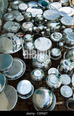 https://l450v.alamy.com/450v/c0f687/indian-stainless-steel-metal-pots-pans-kitchen-utensils-drying-in-c0f687.jpg