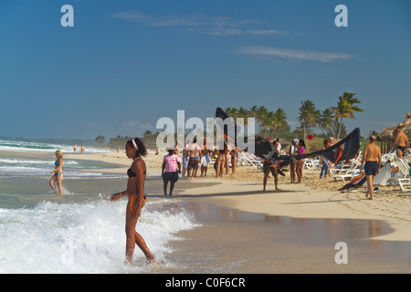 Kite surfer and teenager at Playa del Este, Santa Maria Del Mar, near Havanna Cuba Stock Photo
