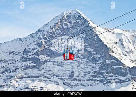 Mannlichen  cabin ski lift from Grindelwald in the background the north wall of Eiger, Switzerland. Stock Photo