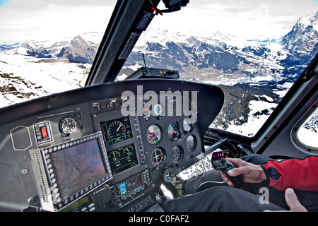 Flying in a helicopter over Alps, Grindelwald, Bernese Oberland, Switerland Stock Photo