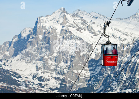 Cabin ski lift from Grindelwald to Mannlichen with Wetterhorn mountain in the background, Bernese Oberland, Switzerland. Stock Photo