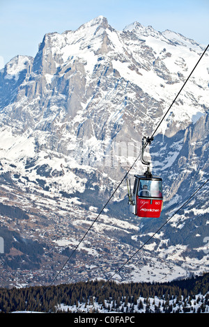 Cabin ski lift from Grindelwald to Mannlichen with Wetterhorn mountain in the background, Bernese Oberland, Switzerland. Stock Photo