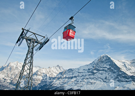 Mannlichen  cabin ski lift from Grindelwald in the background the north wall of Eiger, Switzerland. Stock Photo