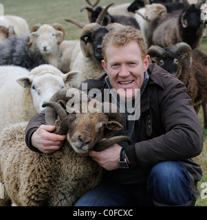 Adam Henson Cotswold farmer with his rare breeds sheep on Adam's farm at Temple Guiting Gloucestershire UK Stock Photo