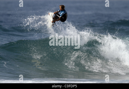 SURFER PRACTICING TRICK PRO SURFER PRO SURFER BALLITO DOLPHIN COAST SOUTH AFRICA 09 July 2010 Stock Photo