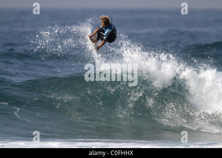 SURFER PRACTICING TRICK PRO SURFER PRO SURFER BALLITO DOLPHIN COAST SOUTH AFRICA 09 July 2010 Stock Photo