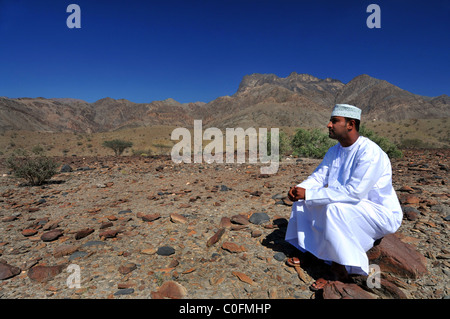 Wadi Bani Kharus, Oman with Omani man. The  Sultanate of Oman. Stock Photo