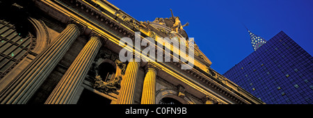 Panoramic view of Grand Central Terminal (Station) exterior with Chrysler Building at dusk in Manhattan, New York City, NY, USA Stock Photo