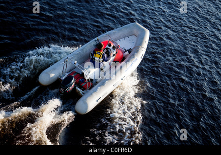 Aerial view of man driving Brig rigid inflatable boat / skiff ( RHIB ...