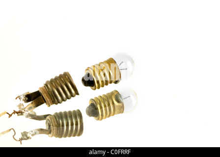 The photography of broken bulb on the white background. Taken on 2011. Stock Photo