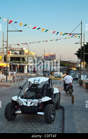 Quad bike parking on street of Aya-Napa. Cyprus. Evening time Stock Photo