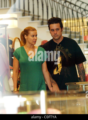 Carmen Electra and Korn guitarist Rob Patterson shoe shopping at ...