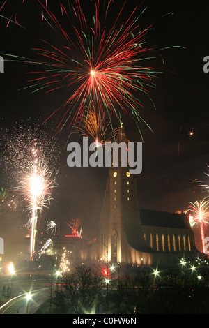 Fireworks by Hallgrimskirkja church in Reykjavik, Iceland, on New Years Eve. Stock Photo