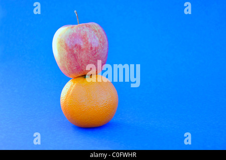 Apples and oranges comparison concept Stock Photo