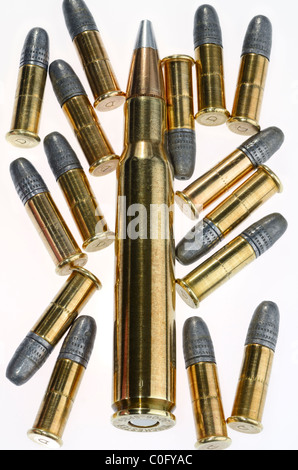 Winchester 30 06 Springfield cartridge and 22 calibre lead rifle bullets on white background Stock Photo