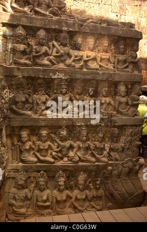 Carved Sandstone Figures on the base of the Leper King Terrace, Angkor Thom, Angkor Wat complex, Cambodia. Stock Photo