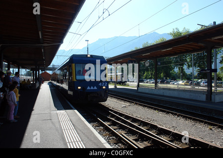 The train station of Interlaken West in Switzerland, from where one can catch a train to Jungfrau, along with tourists Stock Photo