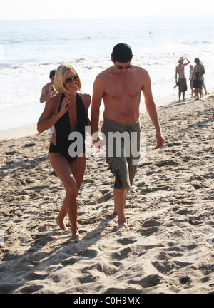 Jenny McCarthy and Jim Carrey take a stroll on the beach before returning to their Malibu pad Los Angeles, California - Stock Photo