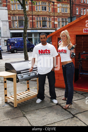 England Cricketer Ravi Bopara with Nuts model Imogen Photocall for the launch of Nuts Magazine's 'The Shed Report', an in depth Stock Photo