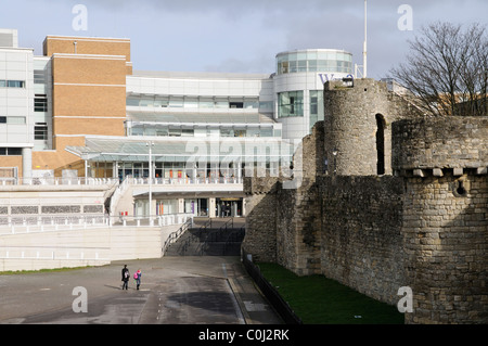 Old and new the modern West Quay shopping complex and the medieval town walls in Southampton southern England UK Stock Photo