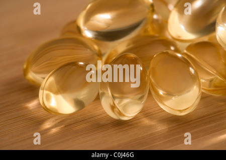 Close up of liquid or oil vitamin capsules Stock Photo