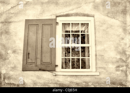 Sepia toned open shutter on an old antique window with added grunge texture Stock Photo