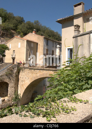 Buildings and a bridge above the Sens river in Rennes-Les-Bains, in the Languedoc-Roussillon region of France Stock Photo