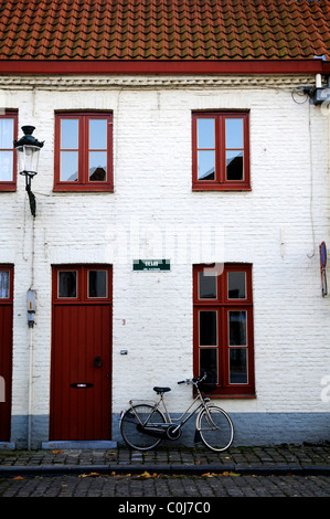 White building and bike Bruges belgium Stock Photo