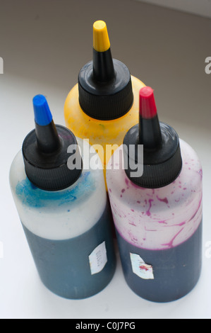 Ink and syringes for refilling cartridges on a white background Stock Photo