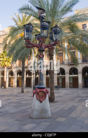 Lamp-post designed by Gaudi at Placa Reial square Barri Gotic quarter central Barcelona Catalunya Spain Europe Stock Photo