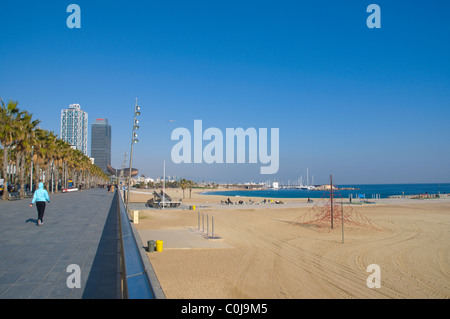 Plaja de la Barceloneta beach and Passeig Maritim de la Barceloneta promanade in winter Barcelona Catalunya Spain Europe Stock Photo