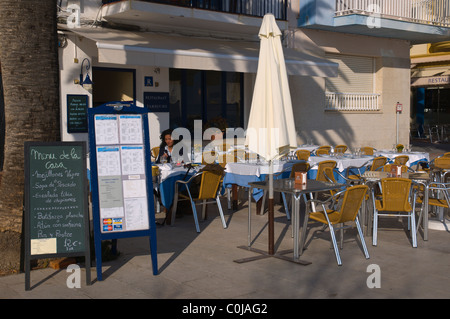 Restaurant terrace at beach on northern side of La Punta church Sitges Catalunya Spain Europe Stock Photo