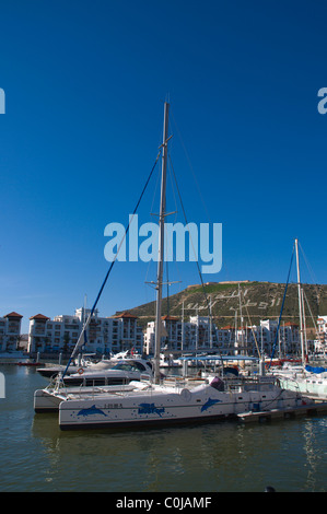 Boats moored at Marina port area with Kasbah in background Agadir the Souss southern Morocco Africa Stock Photo