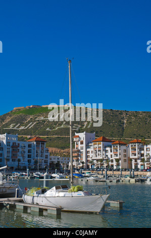 Boat moored at Marina port area with Kasbah in background Agadir the Souss southern Morocco Africa Stock Photo