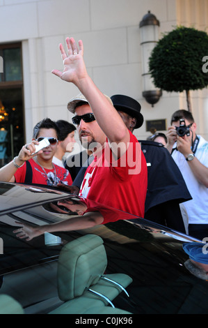 Adam Sandler leaving Ritz Carlton Hotel with a coffee cup Berlin ...