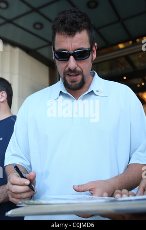 Adam Sandler leaving Ritz Carlton Hotel with a coffee cup Berlin ...