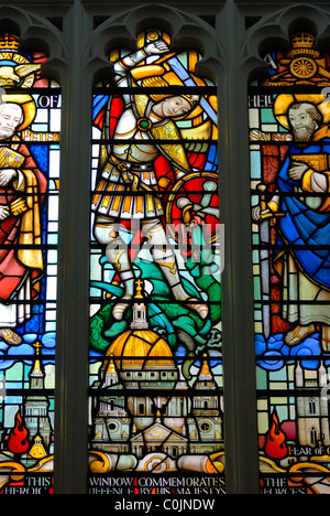 London, England, UK. Church of St Mary Aldermary - Stained Glass Window showing St Paul's Cathedral and St George and dragon Stock Photo