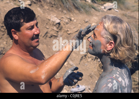 Tourists in Turkey enjoying the mud in the thermal springs near Dalyan.  There are baths at Sultaniye but many like the natural. Stock Photo