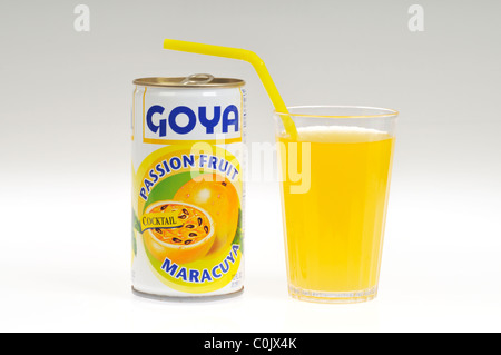 Can of Goya passion fruit cocktail with poured glass with straw on white background, isolated Stock Photo