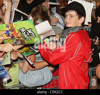 George Sampson signs autographs for adoring fans after his press night performance in 'Into the Hoods' at the NovelloTheatre Stock Photo