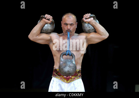 The Moscow State Circus Pictured strong man Bakhrom Akhnazarov Stock Photo