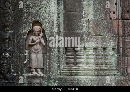 An ancient carving on the temple walls of Ta Som in Angkor, Cambodia. Stock Photo