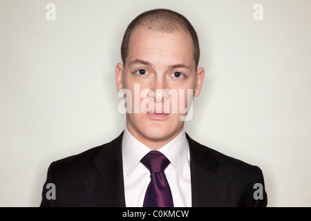 a young man wearing a suit Stock Photo