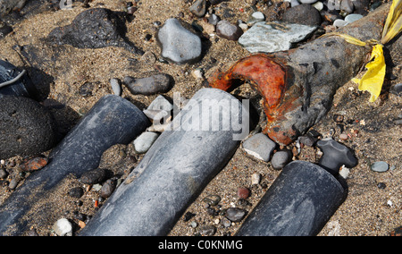 Broken sewer pipes on beach in Spain Stock Photo