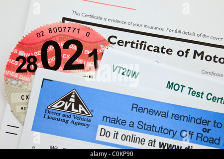 UK, Britain. DVLA renewal reminder form for renewing road tax disc with motor insurance certificate and MOT test certificate Stock Photo