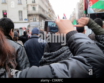 Paris, France, Libya Demonstration, in Support of Libyan Revolution, Detail Hands holding Smart Phone, Taking Photos 'Arab Spring' Stock Photo