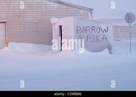 Barrow Alaska written in the snow and ice on a small shed just outside the hospital in Barrow, AK USA. Stock Photo